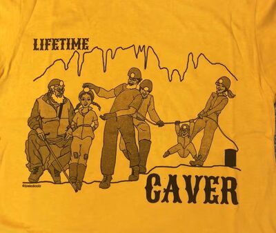 Gold Lifetime Caver T-shirt printed with four generations of cavers exploring a cave passage