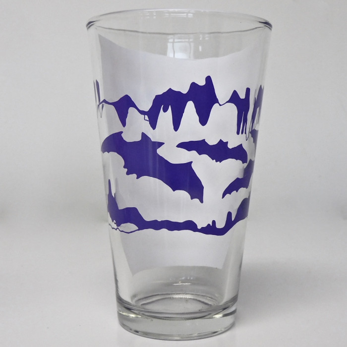 Bats Flying Through A Cave Purple Pint Glass - Product Image